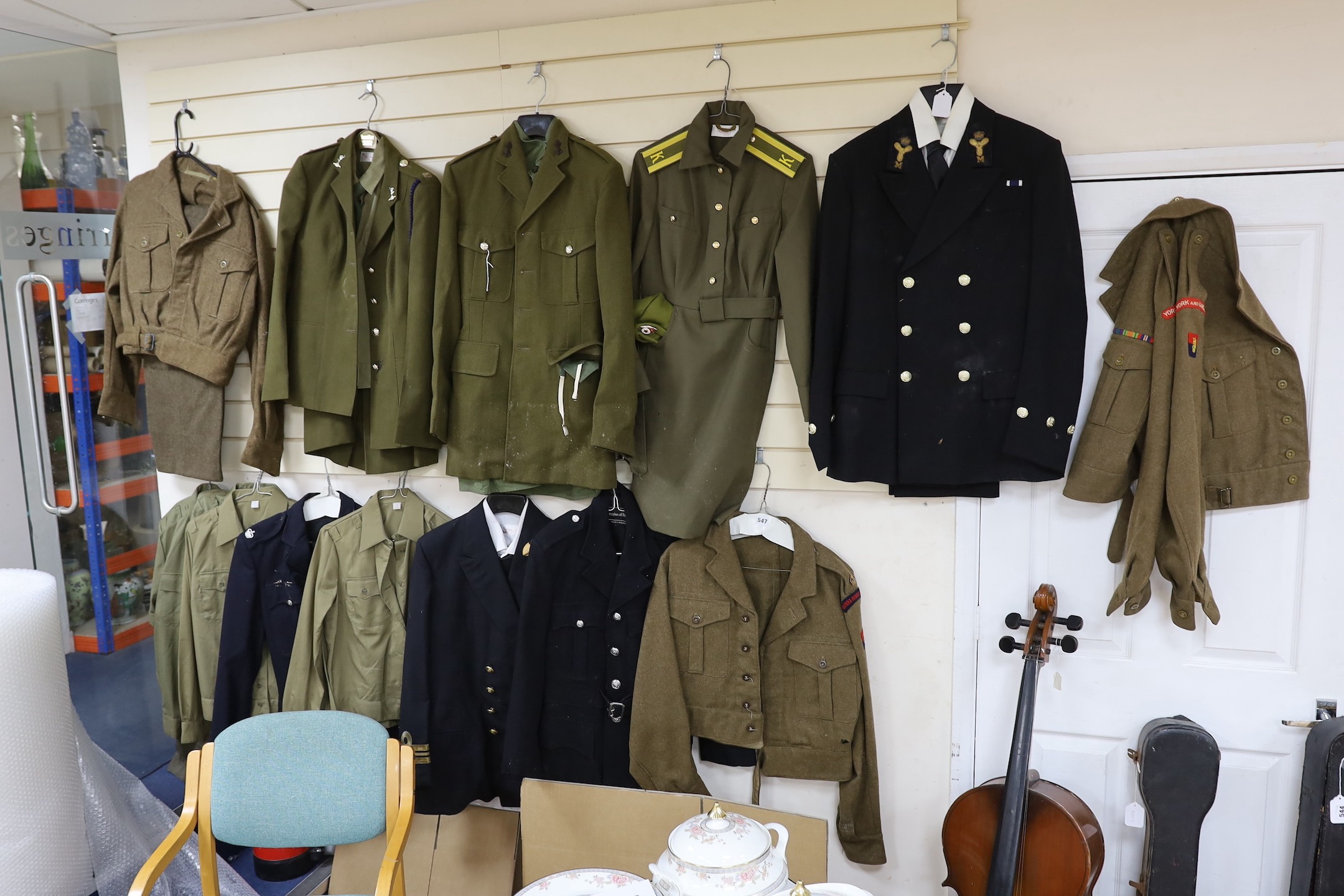 A collection of mixed Royal Navy and army military uniforms, including Royal Australian Corps of Signals (woman’s), Royal Artillery, Russian Army etc.